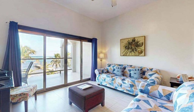 Serene oceanfront condo with shared pool, ocean view, WiFi, & partial AC