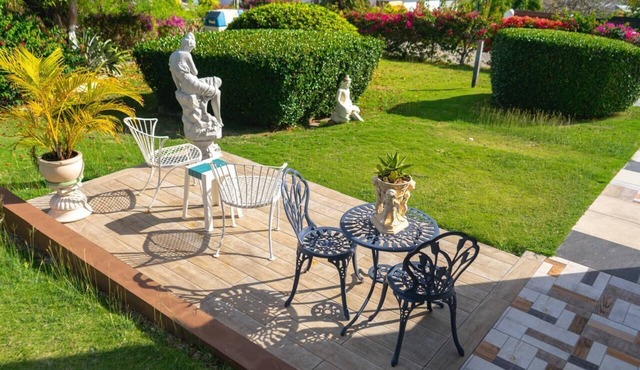 Spacious one bedroom studio with a large patio in a private garden setting