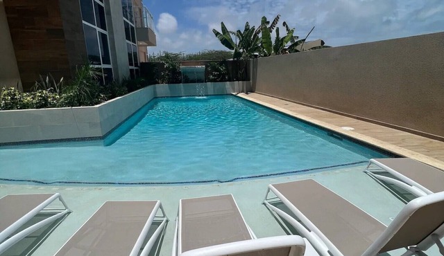 Walk to Palm Beach Pool Modern 2BR Aruba Condo