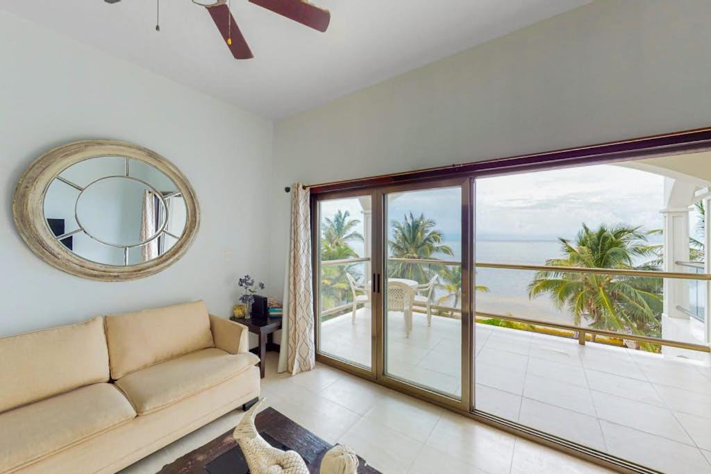 San Pedro House | Beachfront condo with ocean views WiFi partial AC & shared pool dock kayaks